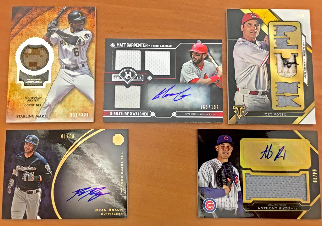 MLB's tweet photo. @Topps The NL Central is up next, and they’re looking good.
   
RT for a chance to win one of these five @Topps #MLBCards. https://t.co/4SVm7kIuou