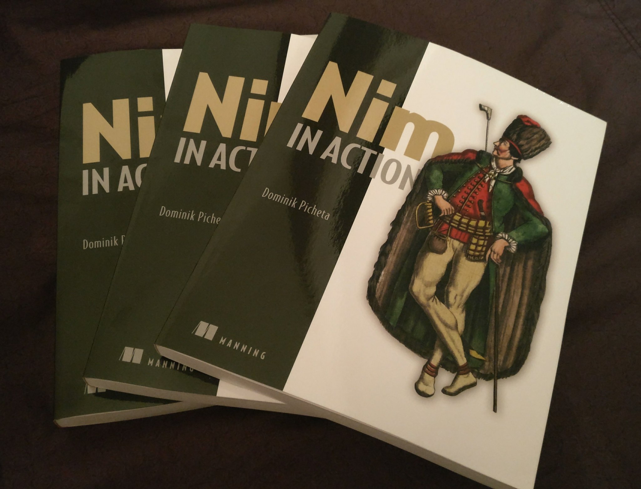 Three Nim in Action books, fanned out