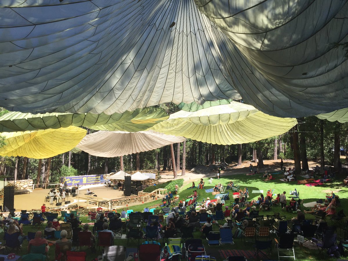 palmspringslife's tweet photo. The parachutes are glowing @IdyllwildJazz. The music is pitch perfect in the woods. #jazzinthepines #weekendvibes https://t.co/1RzJXTxf7W