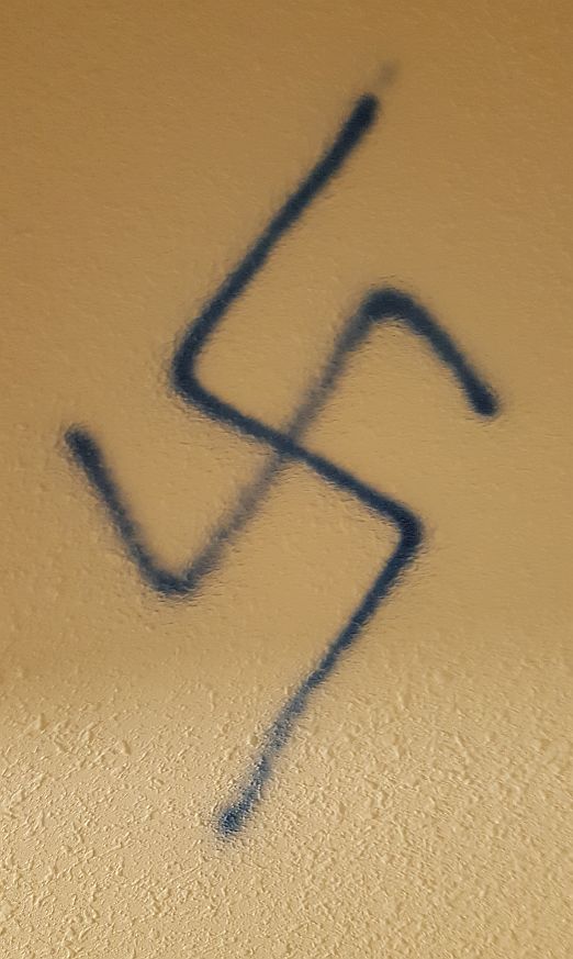 Discovered this new doodle in my apartment stairwell. Hate is closer than you think.