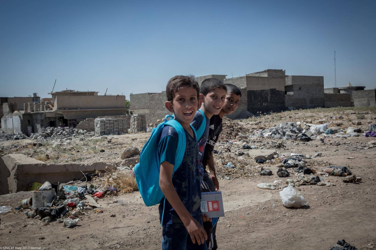 UNICEFiraq's tweet photo. "I don't know if things will go back to how they were before." Akram + friends go to re-opened school via destroyed W #Mosul. #mosulaid https://t.co/cGhBmOrAPw