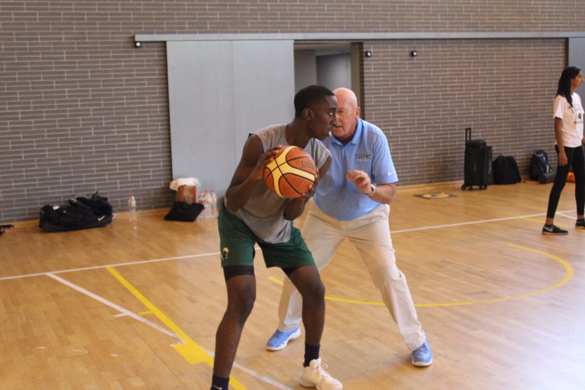 GreenWaveMBB's tweet photo. "You reach, I teach." Head coach @MikeDunleavySr  went 1-on-1 with freshman Shakwon Barrett pre-practice #TulaneInSpain 🌊🏀🇪🇸 https://t.co/ixUu6pCJ3n