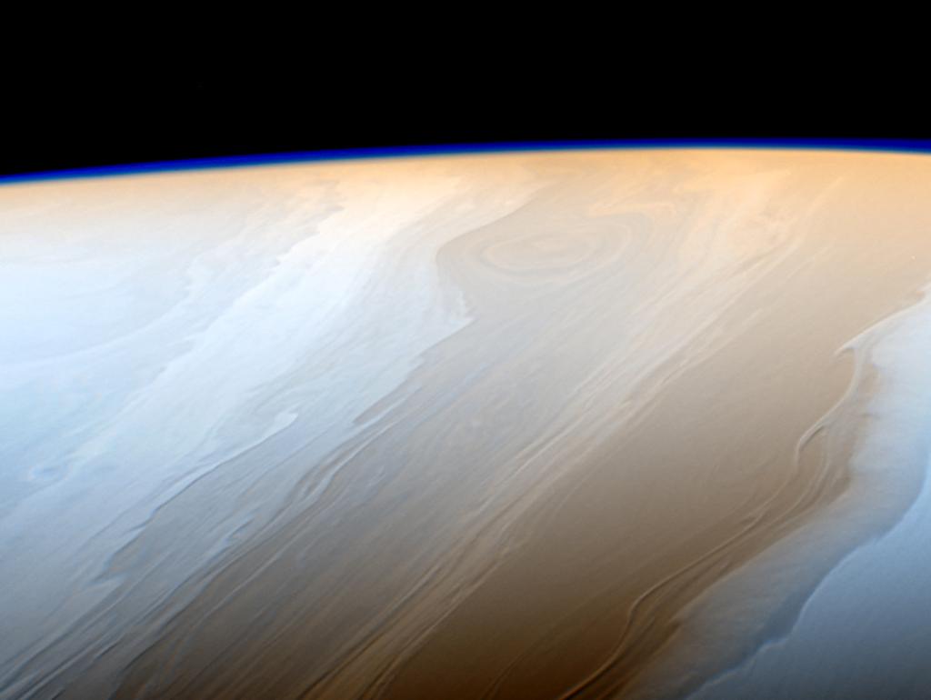 NASA's tweet photo. Thanks to the way that fluids interact in Saturn's atmosphere, these clouds look like strokes from a cosmic brush: https://t.co/RwFw3k7TwJ https://t.co/U2394wAz4u