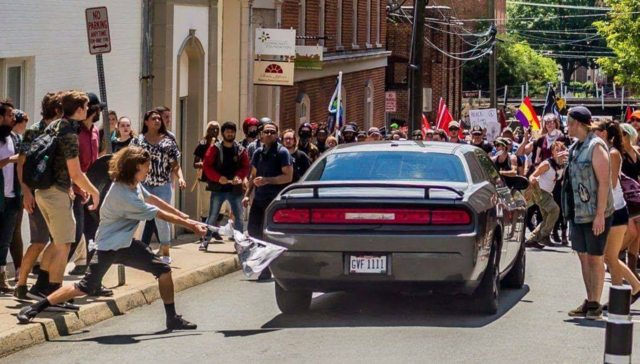 t33jinx's tweet photo. Hmmm, I wonder what's going on in this picture? #Charlottesville https://t.co/srkJ8lD6eF