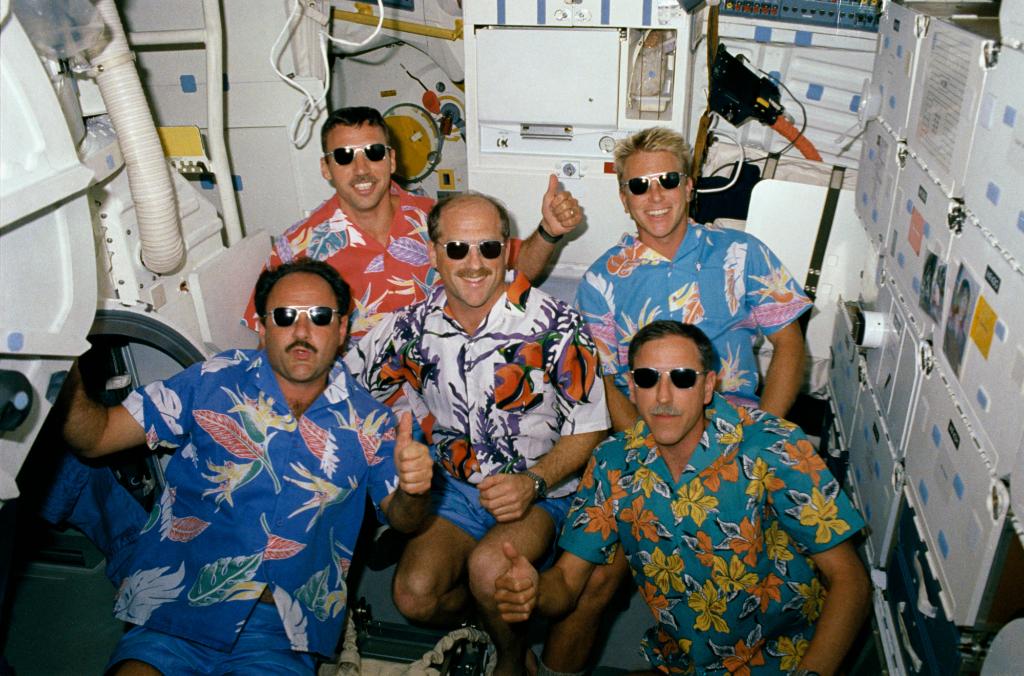 NASA_Marshall's tweet photo. Relaxing in space? How about hawaiian shirts and shades!? @NASA and STS-26 hope you're having a rad #NationalRelaxationDay! #80sCool https://t.co/VrCq2KzmoJ