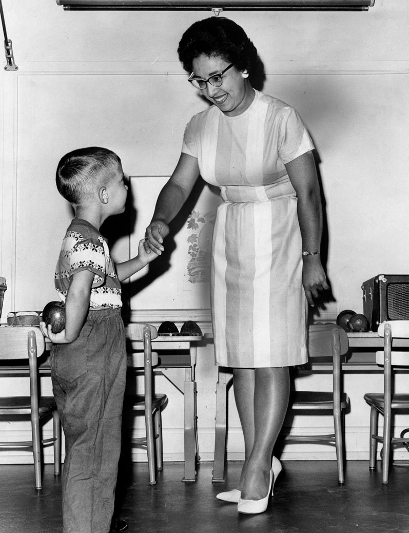 Child with apple on first day of school.