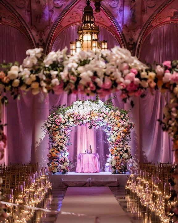 Fab #weddingalter transformed by #uplighting + floral details! Great photo via #MunozPhotography