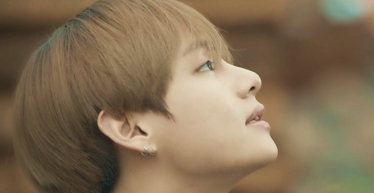 Taehyung's side profile is pure perfection, a masterpiece.