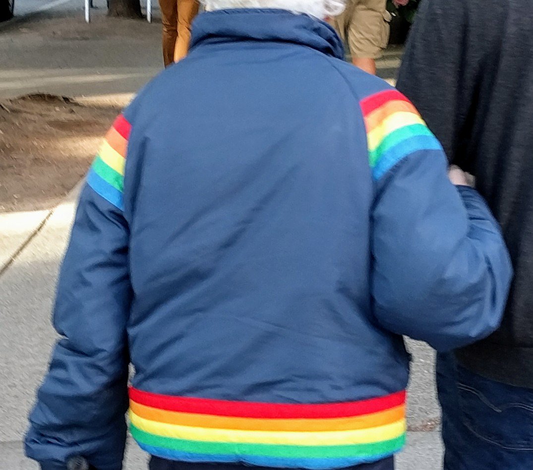 retroist's tweet photo. Spotted the coolest jacket in the world on my walk to work this morning. #rainbowjacket https://t.co/bPXns2eJEx