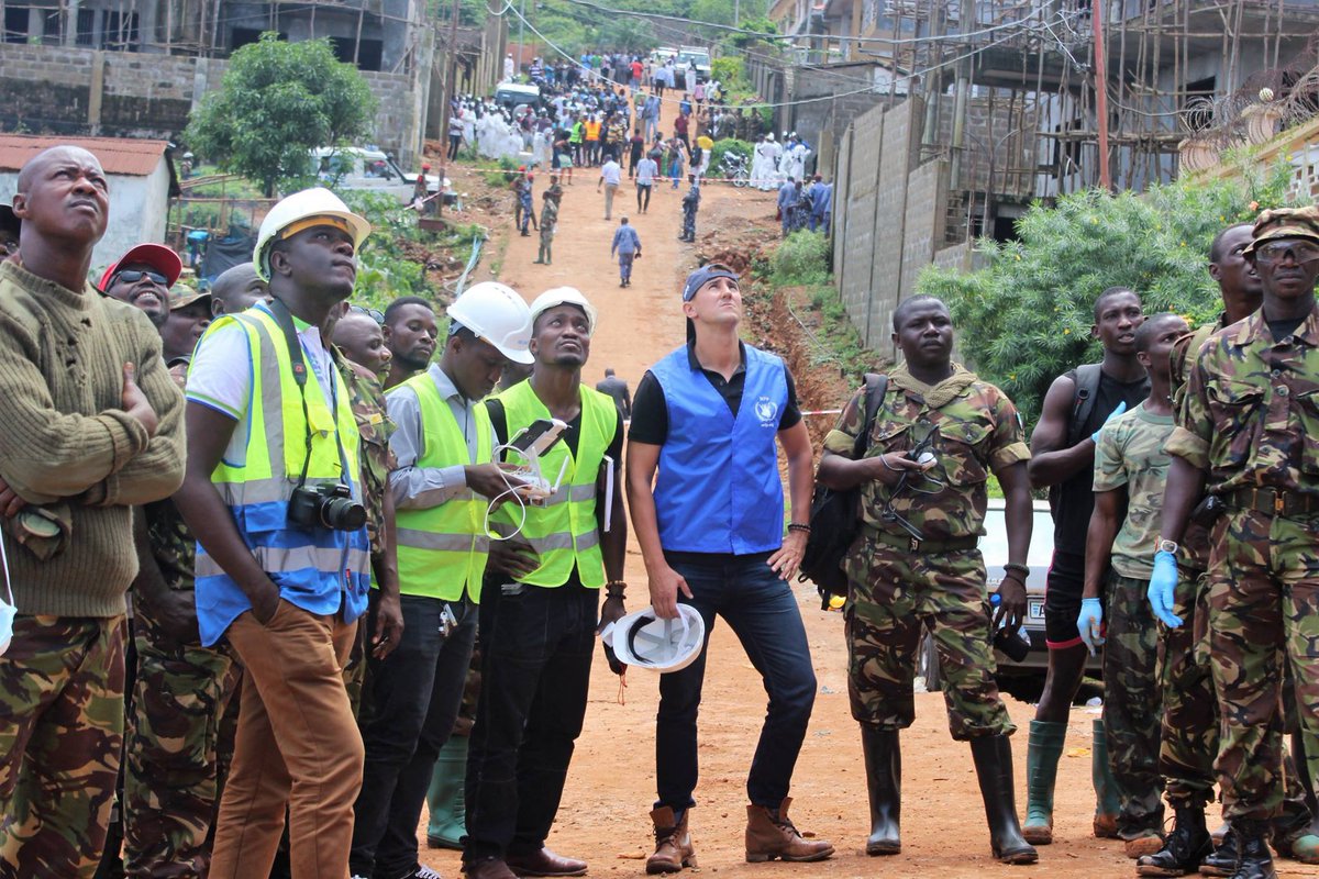 crownagents's tweet photo. ...with people of Sierra Leone, proud of our colleague James for supporting drone surveillance of affected areas with @trackyourbuild [2/2] https://t.co/fC17XidMqd