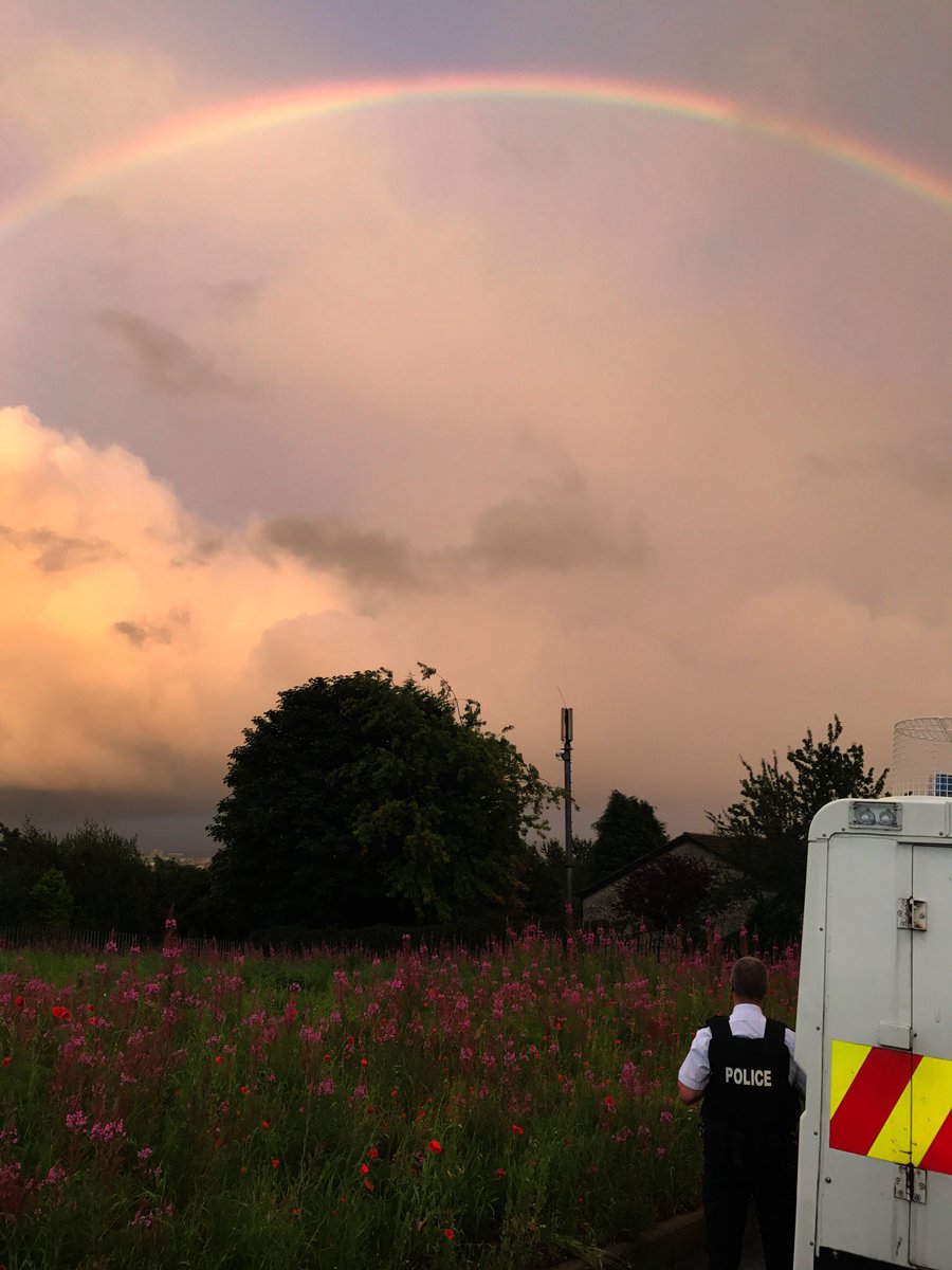 PSNIBelfastW's tweet photo. Tennet St NPT on the ground. What a sight!! #rainbow #wildflowers #dunboyne #SpringfieldRd #strangeskys @barrabest SgtW https://t.co/2AEdMULjc1