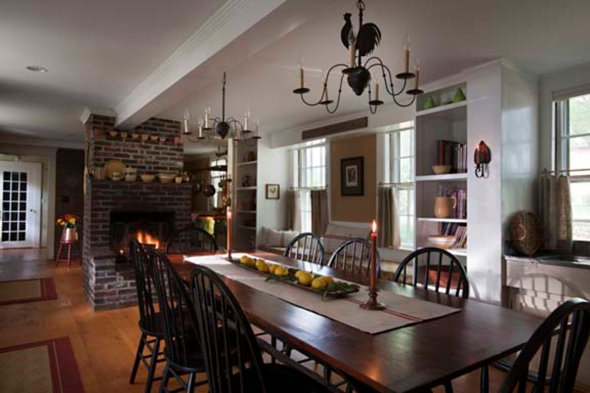 A sawbuck dining table milled from lumber salvaged from an old shed on the property fit well in this cooks kitchen.