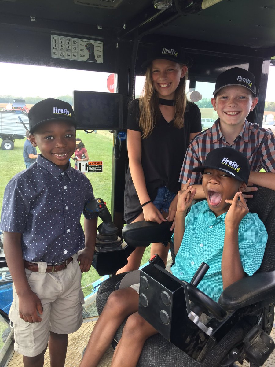 FireFlyRobotics's tweet photo. Cutest #fireflyequip hat models at Ohio Sod Producers Association show in the cab of a #proslab155 https://t.co/XX08aDCtni