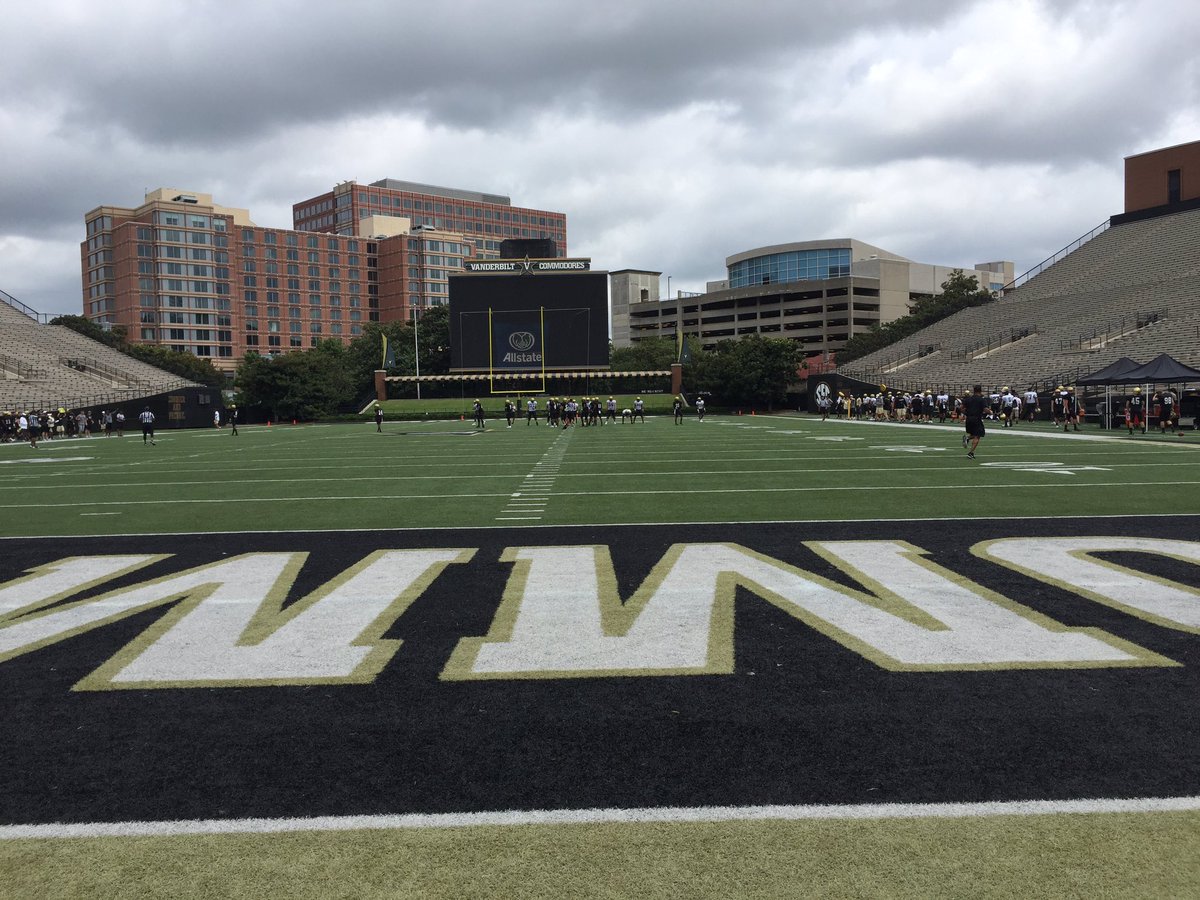 Football practice taking place in the big stadium today