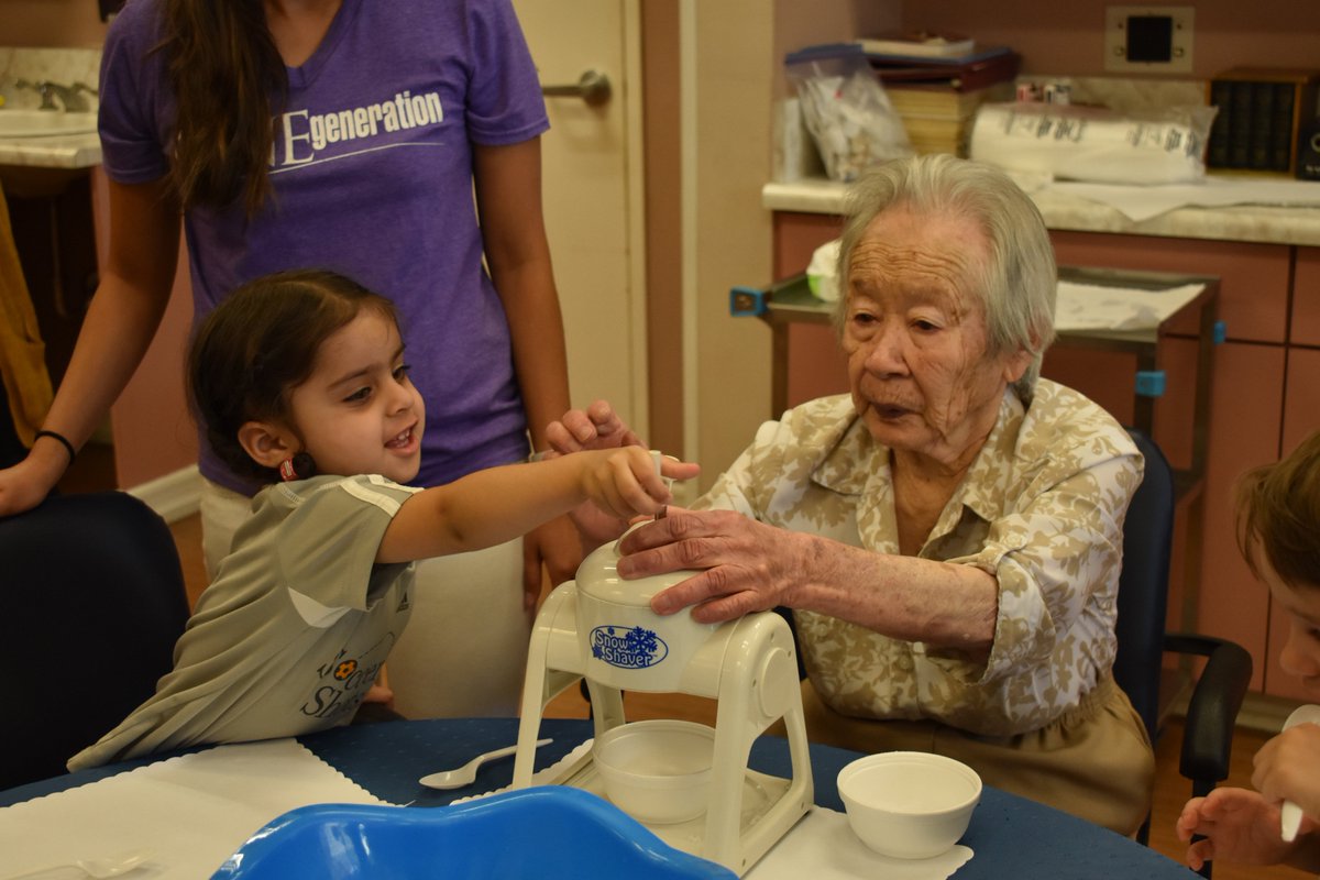 ONEgenCares's tweet photo. Summer fun for the @ONEgenCares kids making snow-cones with their senior neighbors today!  #Cooligideas https://t.co/Bt248oKVmx