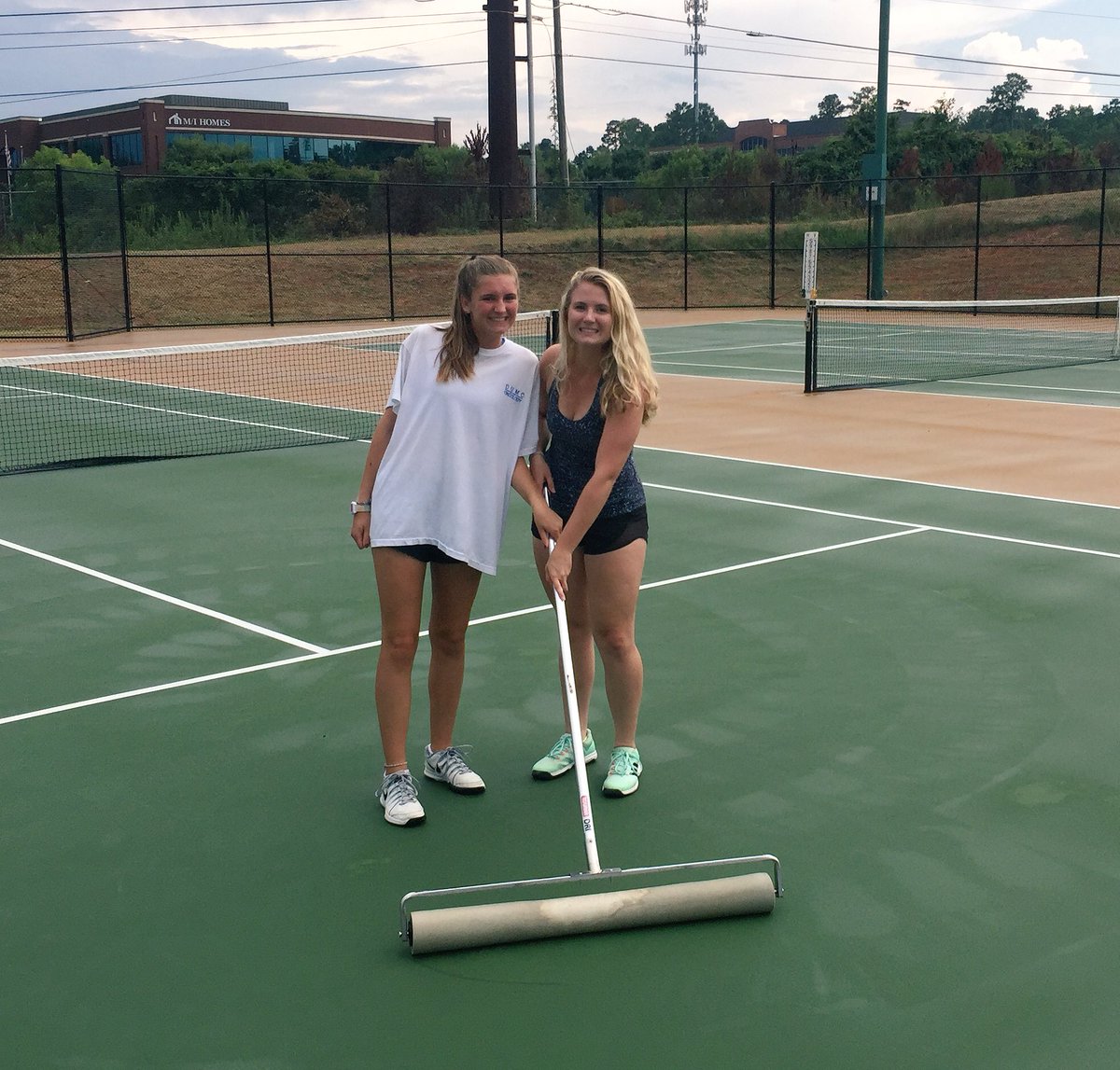 Tennis_cghsnc's tweet photo. The Varsity team wrote notes of encouragement to the JV team, then helped dry the courts &amp; cheer them on during their first match.  #Family https://t.co/MY78TvzO5o