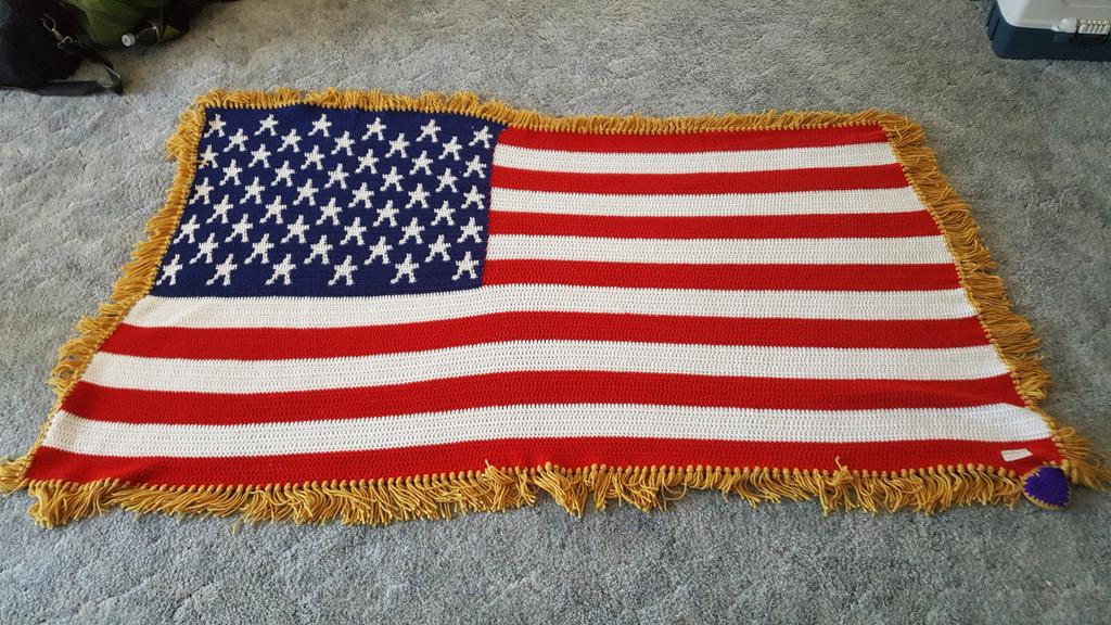 This is a flag Afghan that incarcerated veterans crochet for the families of fallen soldiers in Oklahoma.