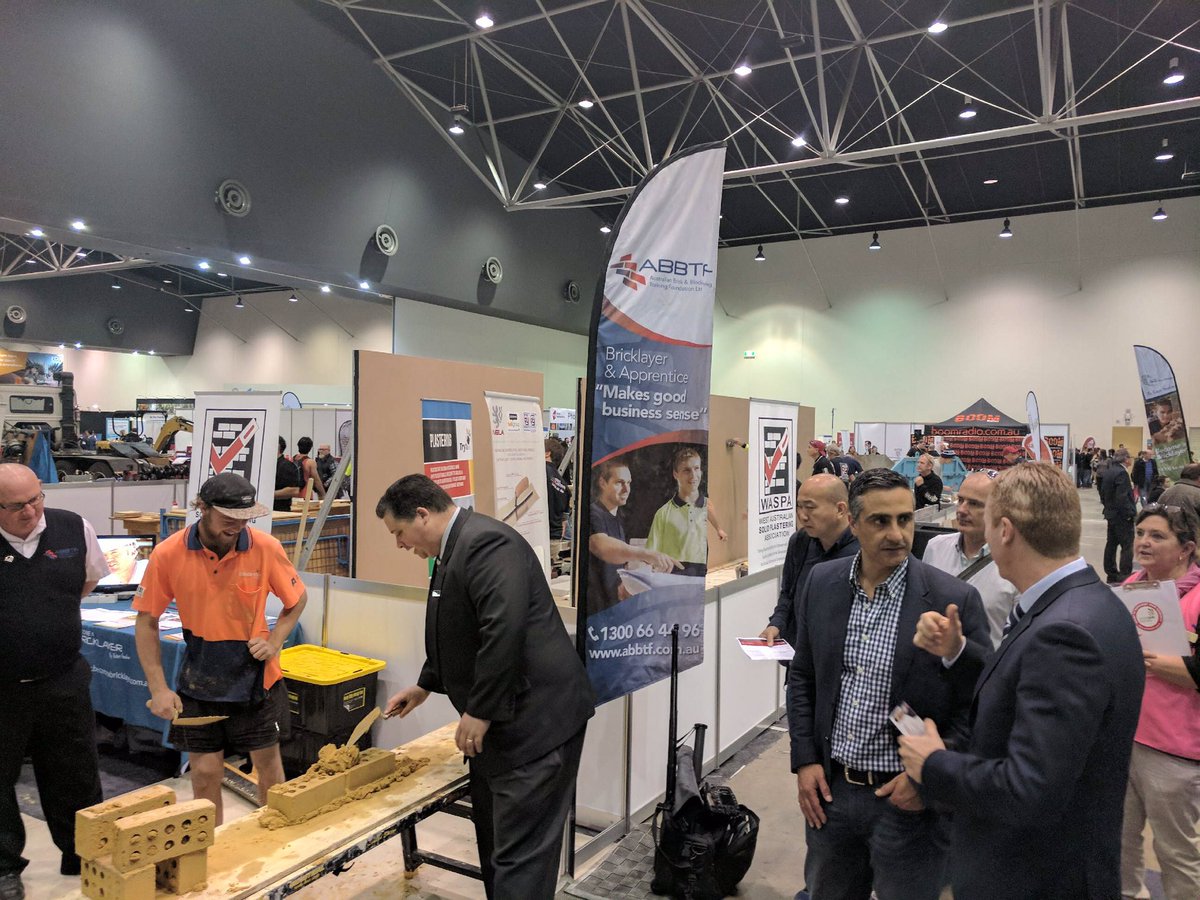 WorldSkills_AU's tweet photo. At the @skillswestexpo in #Perth watching the #WA Minister do a bricklaying #tryaskill alongside the #ABBTF, HIA and our CEO Brett Judd https://t.co/VjQzbOHQY7