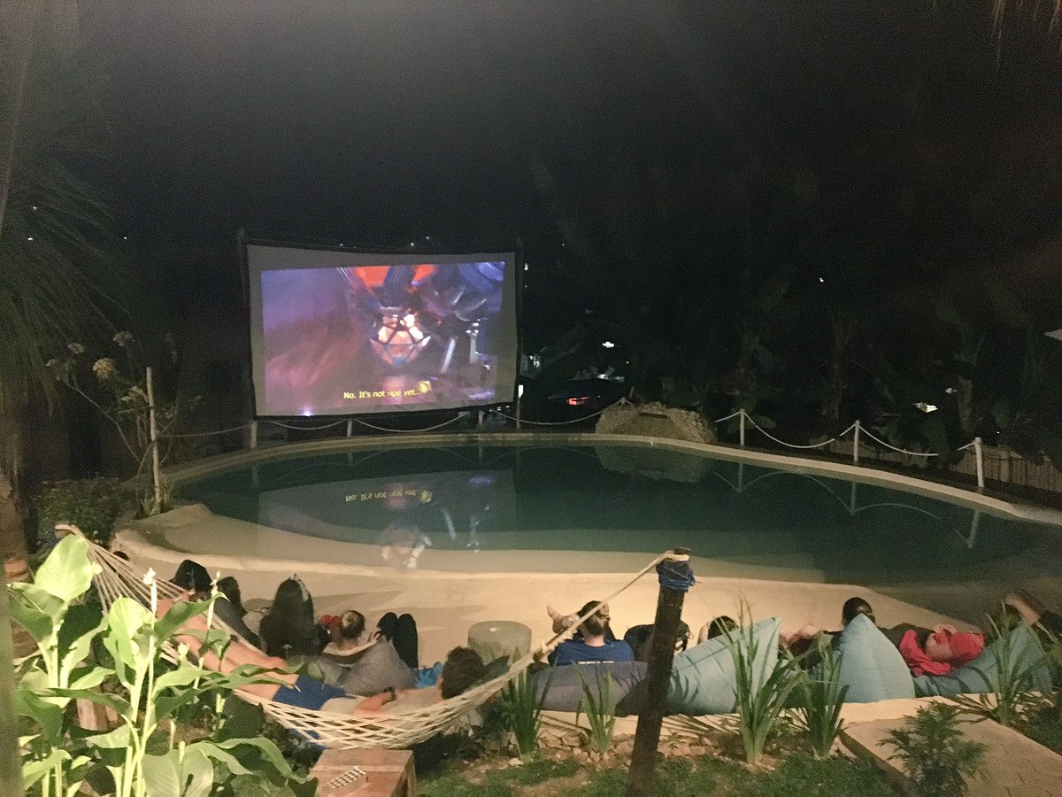 OxtedIndonesia's tweet photo. @OxtedIndonesia #team5 knows how to chill out - off to Bali tomorrow 🇮🇩 'Open air cinema' night by the pool at the nearby spa 😀 https://t.co/BtqmSD9lKE