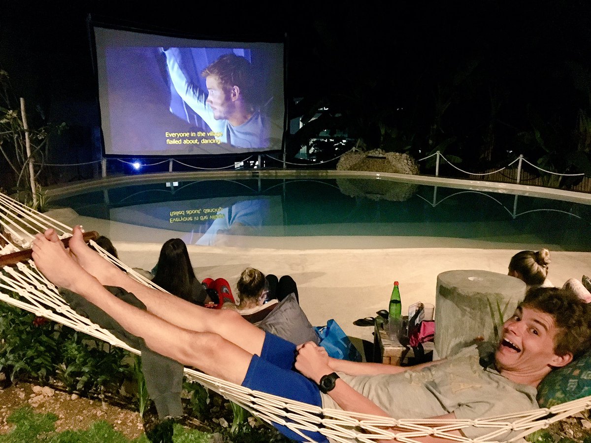 OxtedIndonesia's tweet photo. @OxtedIndonesia #team5 knows how to chill out - off to Bali tomorrow 🇮🇩 'Open air cinema' night by the pool at the nearby spa 😀 https://t.co/BtqmSD9lKE