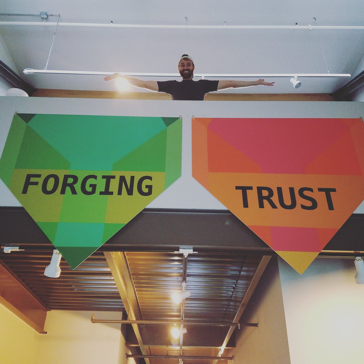 smartgivers's tweet photo. Thanks to Council friend, Adam for helping us hang our #ForgingTrust pendants today. They look GREAT! #OtherDutiesAsAssigned https://t.co/bRfLl1KMYr