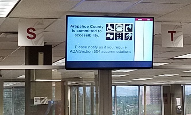 sign in county service office: Arapahoe County is committed to accessibility with icons for accommodations available.
