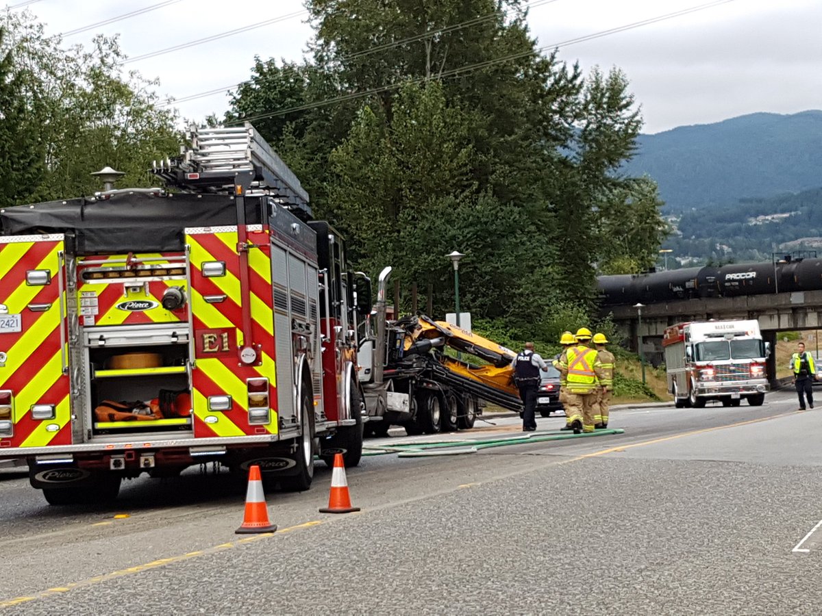 ScanBC's tweet photo. #Coquitlam crews on scene with a crane truck that hit a train overpass. Lougheed Hwy closed at Barnett. Driver ran away. https://t.co/SGnWE63YoH