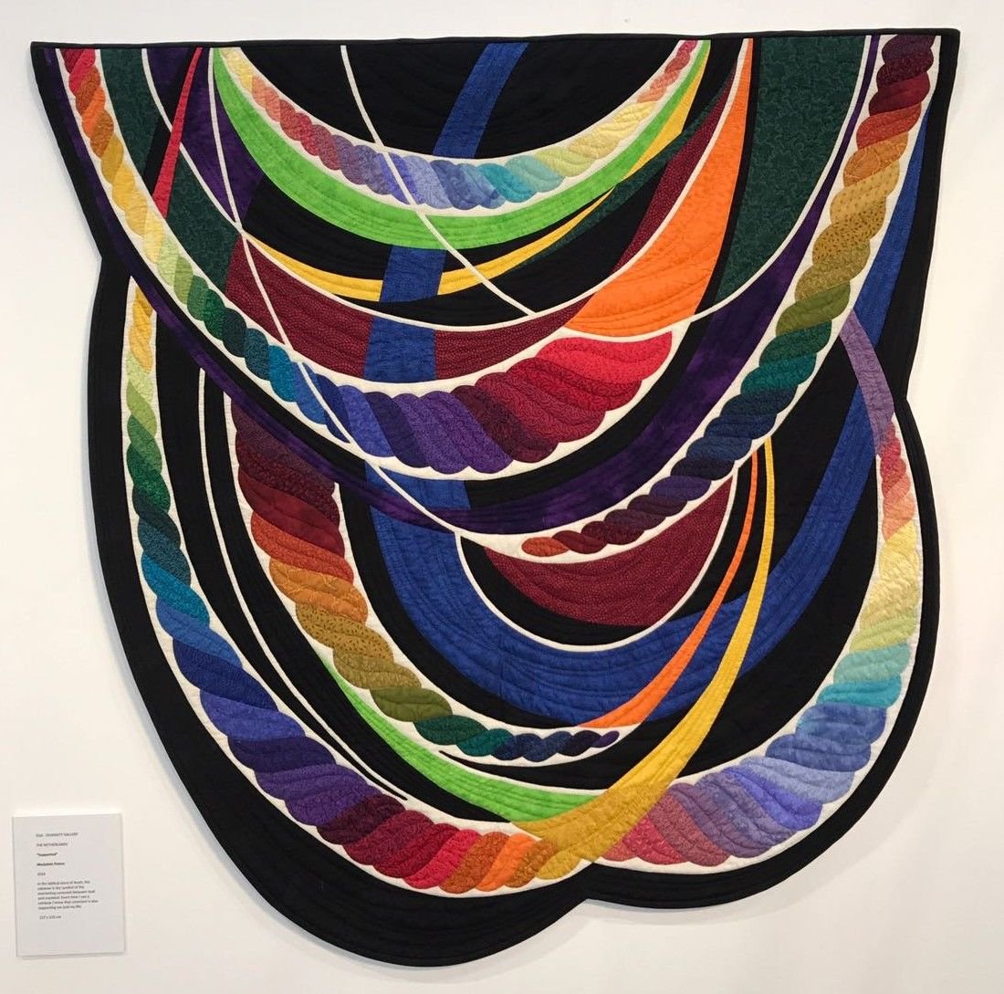 patchworkshopuk's tweet photo. Who said quilts had to have straight sides?! A beautiful piece of work. 'Supported' by Marjolein Peters. #FOQ2017 https://t.co/YFnpETAygH