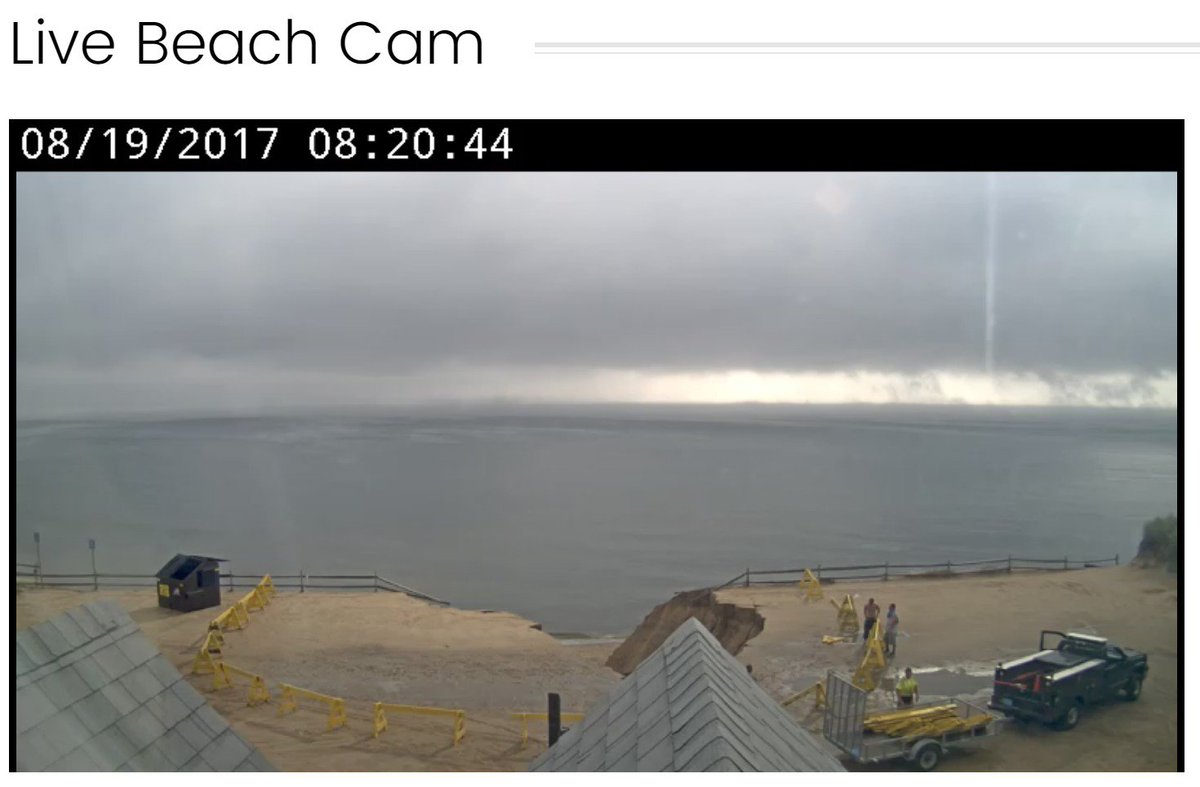 capecodweather's tweet photo. Live @TheComah cam shows the erosion from the heavy rain as well. Big chunk of the parking lot gone. https://t.co/JoZX7aw7P0
