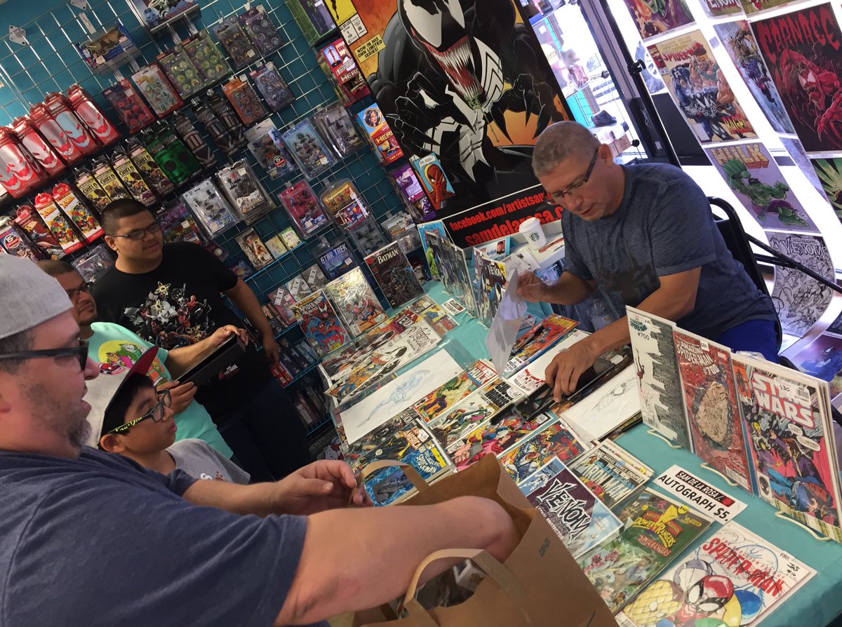 Sam's booth is hoppin'! Lots of activities going in still!