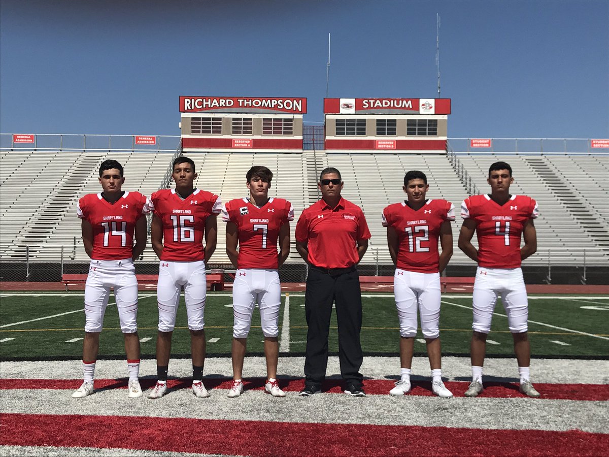 Varsity QBs with Coach Adame.