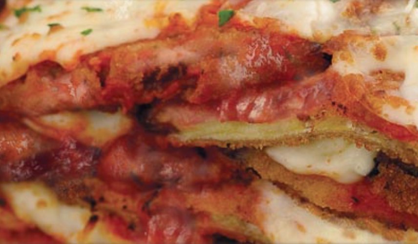 Our Eggplant Parmesan is made with fresh eggplant lightly breaded, Mom's tomato sauce &amp; Mozzarella. Pairs nicely with a crisp garden salad.