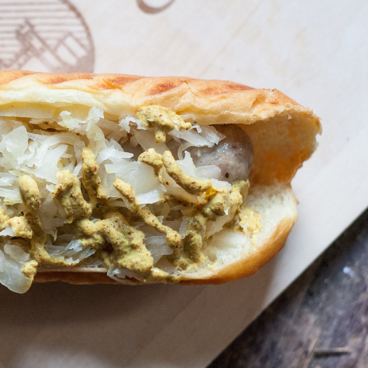 The Classic. The S&amp;W brat topped with our mustard and sauerkraut.