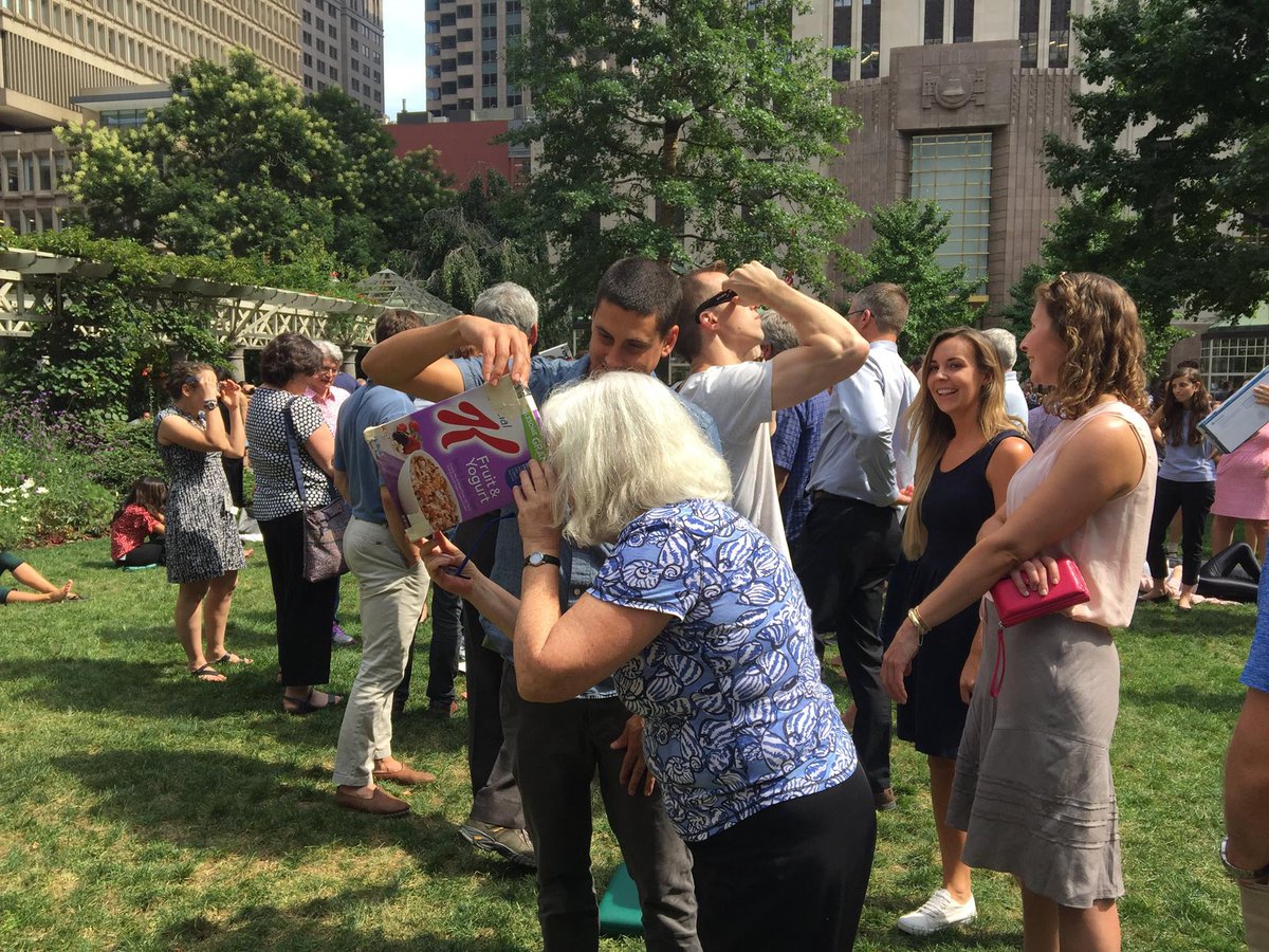 BrownRichardson's tweet photo. Checking out the Solar Eclipse in Post Office Square Park! https://t.co/Y0bg2J87QS