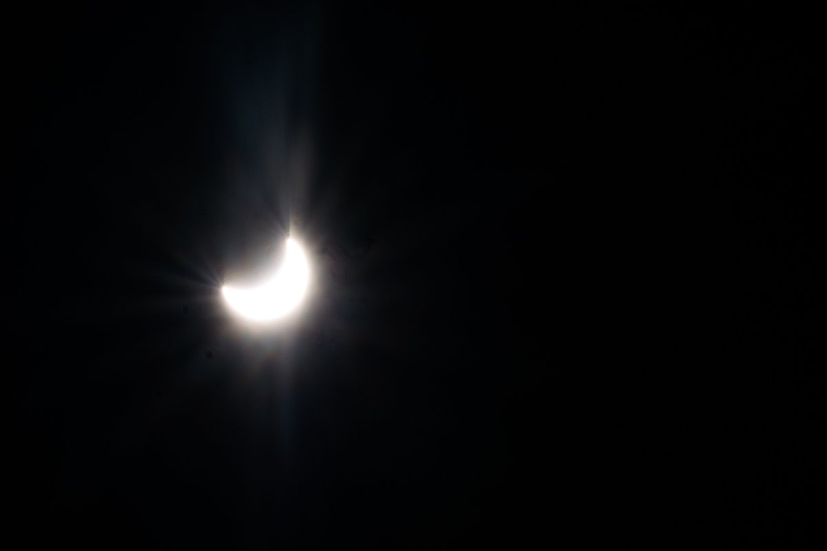 TAMUSanAntonio's tweet photo. Check out the #SolarEclipse2017 over #TAMUSA! What an amazing view! Great photo by @nan. https://t.co/wd1IZblQQn