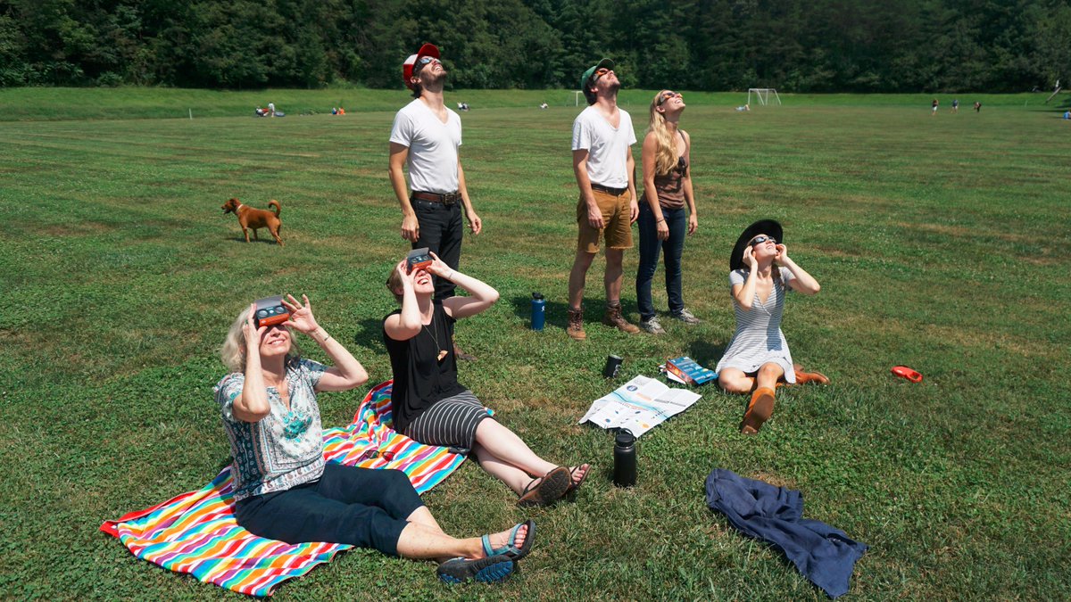 WWCasheville's tweet photo. The campus community gathered at the soccer field to watch #SolarEclipse2017. #AVLeclipse #SolarEclipse #avl @WLOS_13 @asheville @WBTV_News https://t.co/lRJ2mReP0F