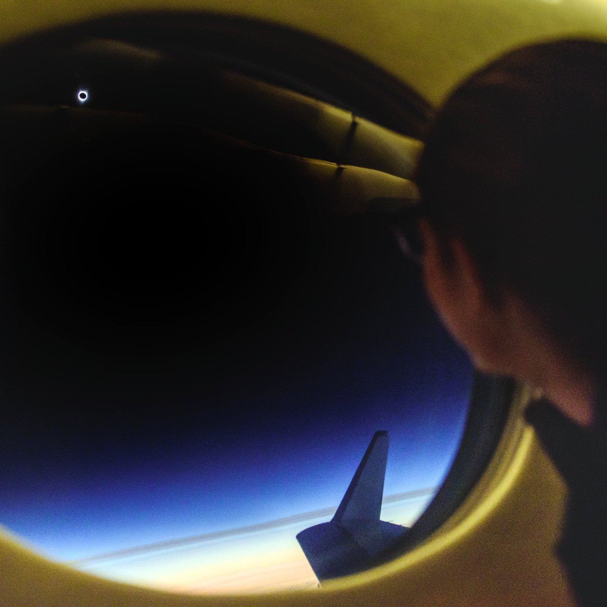 Airbnb's tweet photo. Our #NightAt winners experiencing the eclipse from 40,000 feet. 

Photo credit: @BabakTafreshi with @NatGeo https://t.co/r9J1s5d04x