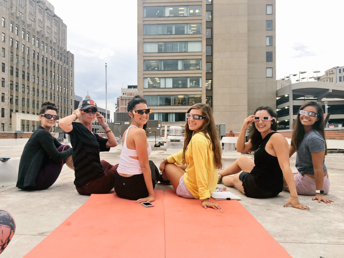 LNKflystudio's tweet photo. No better way to experience the #LNKeclipse than rooftop views post-yoga! https://t.co/4TFe0mSyBj