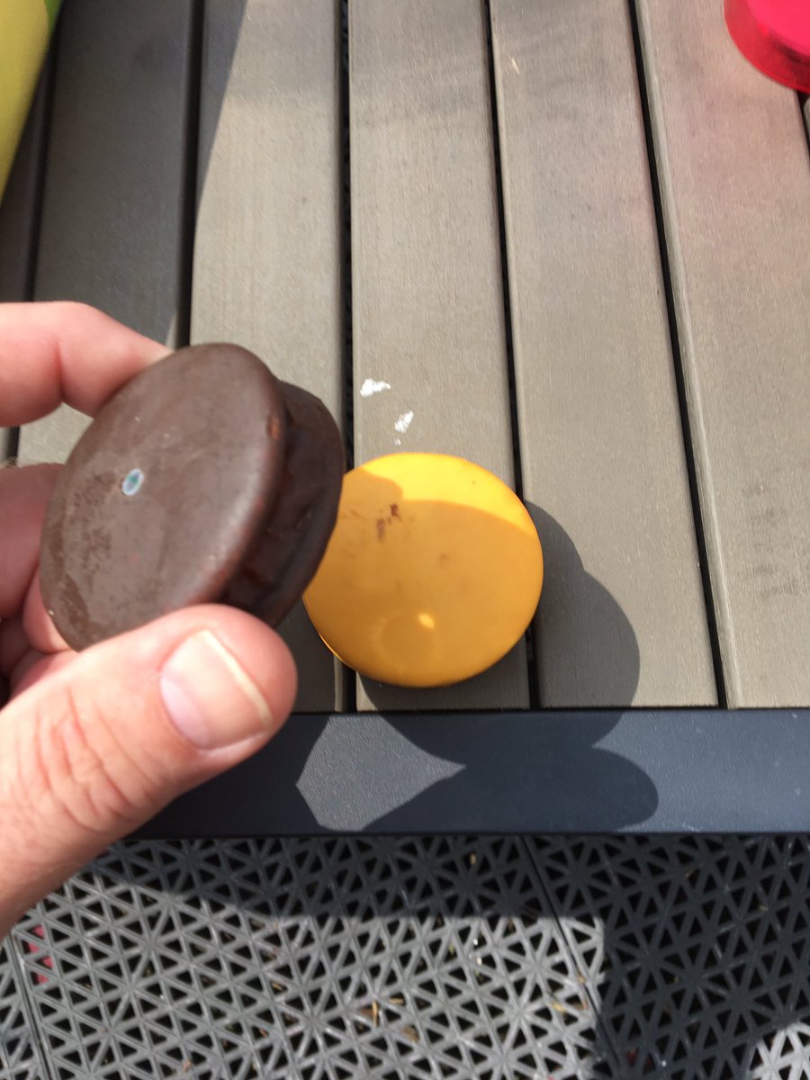 j_2661's tweet photo. Solar eclipse thru a Moon Pie onto a Moon Pie
#MoonPieEclipse https://t.co/BnrMiLAb8G