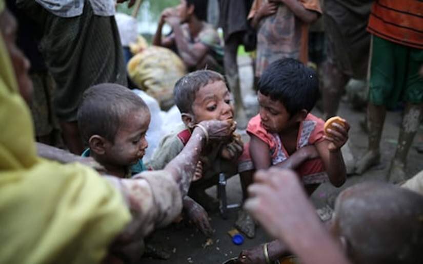 Rohingya eat after arriving in Bangladesh.
 
120,000 refugees in last 2 wks
400,000 trapped in Myanmar conflict zones
UN aid still blocked