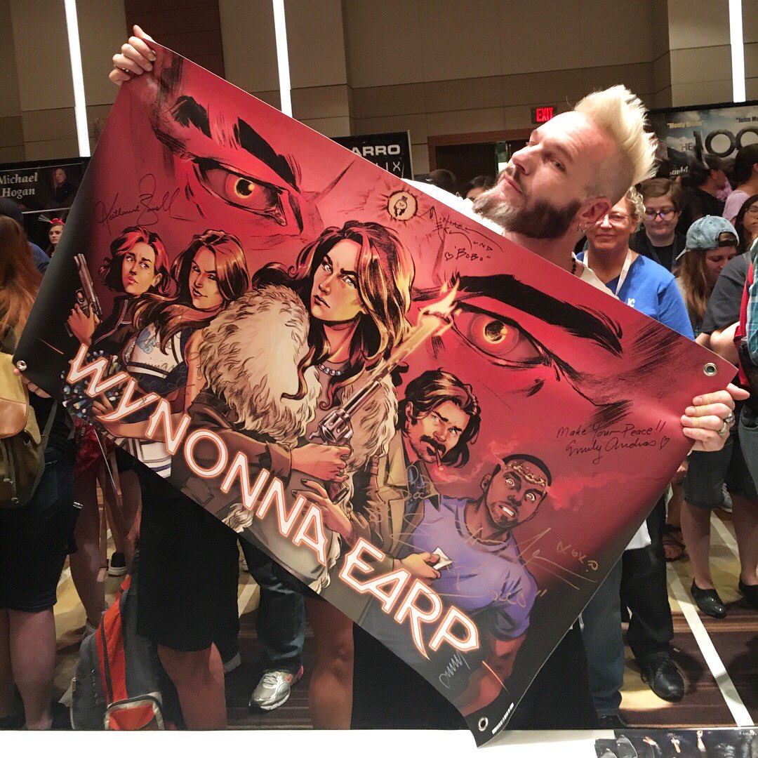 LoraInnes's tweet photo. The cast of @WynonnaEarp signed my banner at @DragonCon. We're going to auction this off for @Love146 again! https://t.co/4UKVLMPuVp https://t.co/ffJLKNVUMR