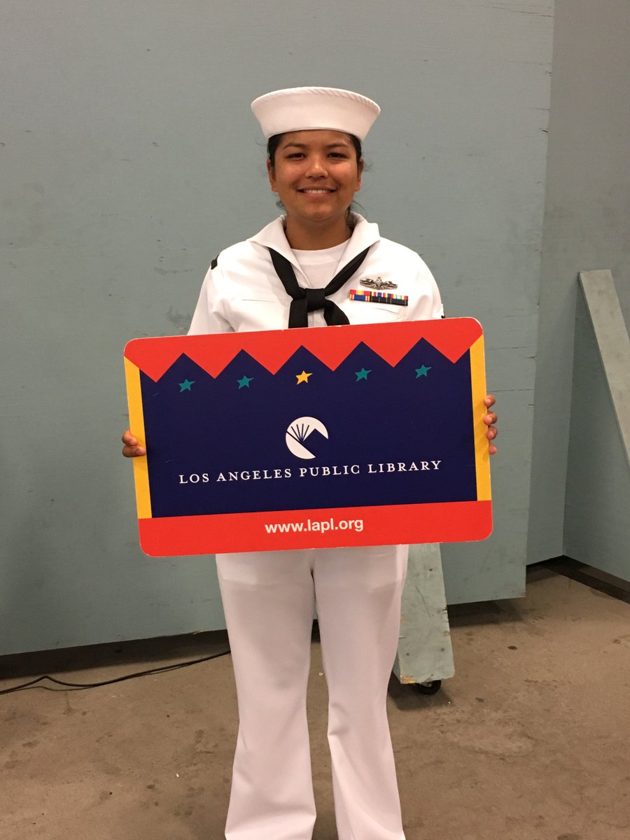 Person holding giant library card