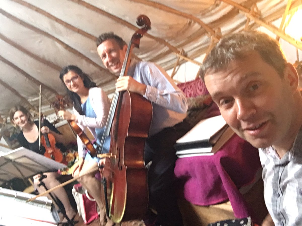 OccStrings's tweet photo. Playing for the Red Cross for open garden day today. Rain meant we had to retire to the yurt, so playing in our socks... :-) https://t.co/szeWxnrupP