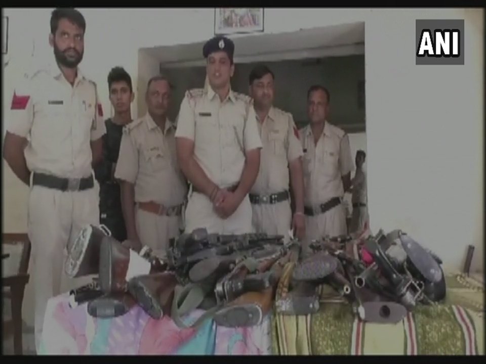 ANI's tweet photo. Haryana: Huge cache of arms recovered by Police from #DeraSachaSauda HQ in Sirsa. https://t.co/2yPVewn05L