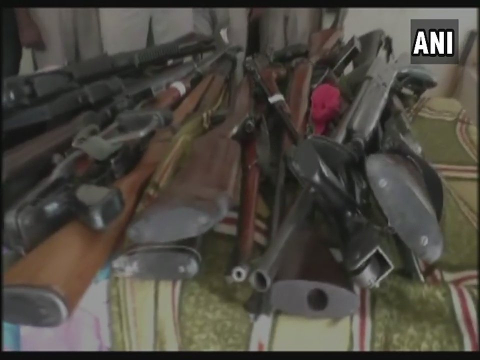 ANI's tweet photo. Haryana: Huge cache of arms recovered by Police from #DeraSachaSauda HQ in Sirsa. https://t.co/2yPVewn05L