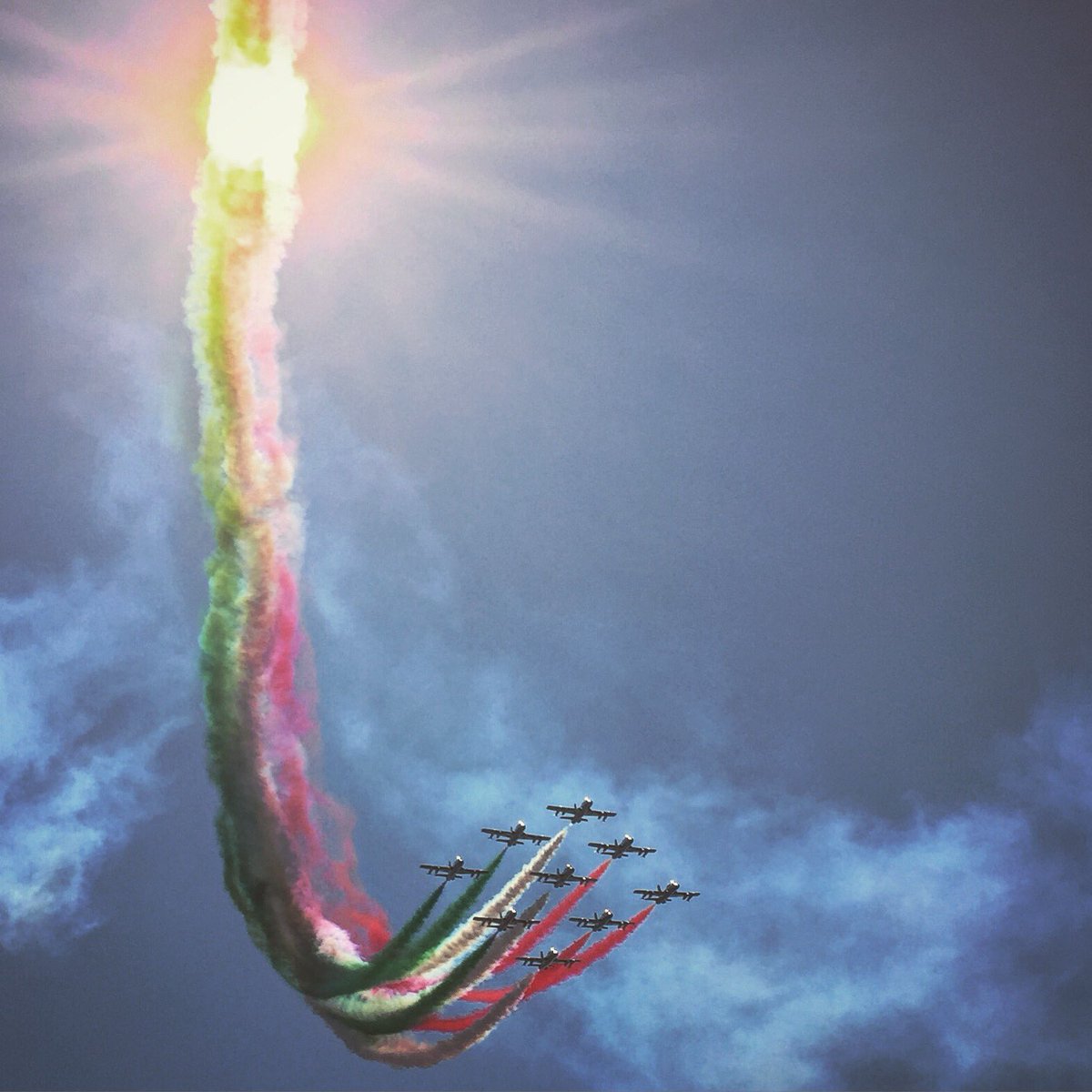 NobleF1's tweet photo. The Monza fly past was so cool this year. Perfect spot for making the sun go green, white and red... #tricolori #monza #f1 https://t.co/GDtdb7boCh