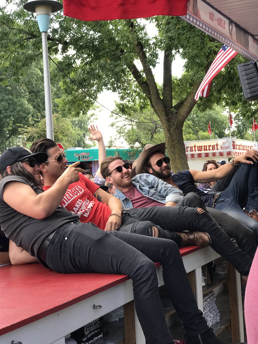 TCountrySource's tweet photo. !!! @LancoMusic taking a group picture at @K102 at the #MNSTATEFAIR // Thanks @K102 for having @LancoMusic at your booth. https://t.co/uxdsQ2Uaez