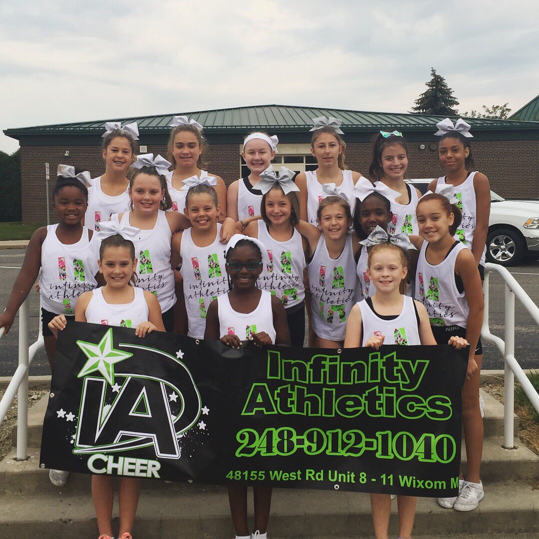 ICE_Michigan's tweet photo. Happy Labor Day from everyone at Infinity Athletics!! We had a blast at the parade today representing IA 💚🖤#infinitystrong #summertimefun https://t.co/XOAZwlloAK