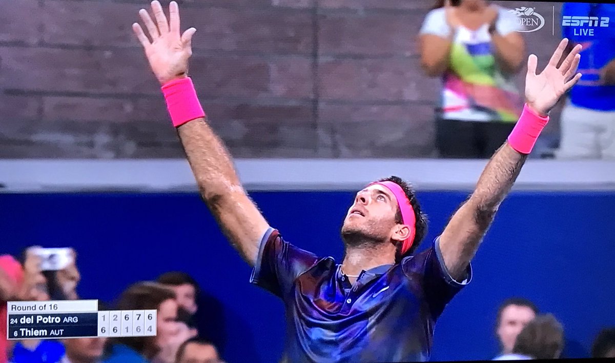 Juan Martin DelPotro stretches arms in the air after a stunning comeback