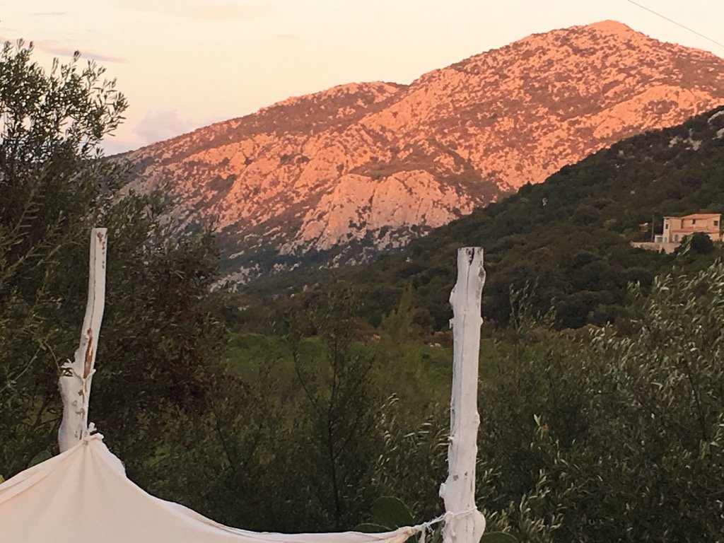gaskell_mike's tweet photo. Setting sun reflecting on limestone  @SUGOLOGONE #sardinia #Sardegna this evening. #magical https://t.co/cMxHrwUDBe
